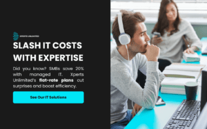 A professional with headphones works at a desk with a computer and books, alongside a colleague, illustrating how to slash it costs with managed IT. Xperts Unlimited’s flat-rate plans boost efficiency and save SMBs 20%